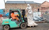 A man driving a forklift on site at the Citizens Theatre building redevelopment.