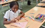 Primary five pupil from St Teresa's Primary in Glasgow enjoying taking part in The Little Amal project, part of COP26.