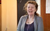 A woman laughing.