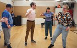 A group of adults laughing.