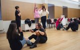 A group of learning disabled young people playing a drama game.