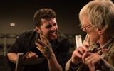 A production shot. Two men are intensely talking to each other.