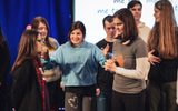 A group of young people standing on a stage.