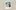 A faded polaroid picture of a young woman in glasses sitting in a field of flowers. A heart and 