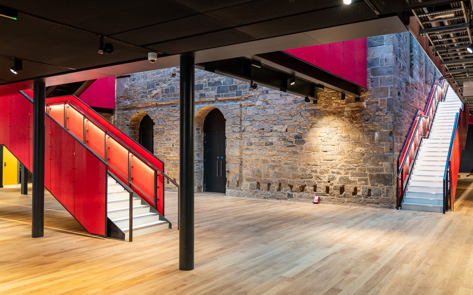 Interior of our new foyer. It's a bright open space with a pink staircase.
