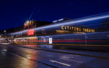 Outside of the Citizens Theatre with all three external lights lit.
