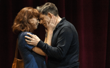 A man and woman embracing.