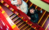 Jamie Rea and Dylan Wood standing together in a stairwell at the Barrowlands.