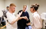 Three people having a chatting in British Sign Language.