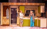 Victoria Brazier and Samantha Power as Aunt Annie and Ella in East is East. they are chatting together in a 1970s style kitchen.