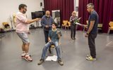 Kash Arshad gives directions to the cast of East is East in rehearsals.
