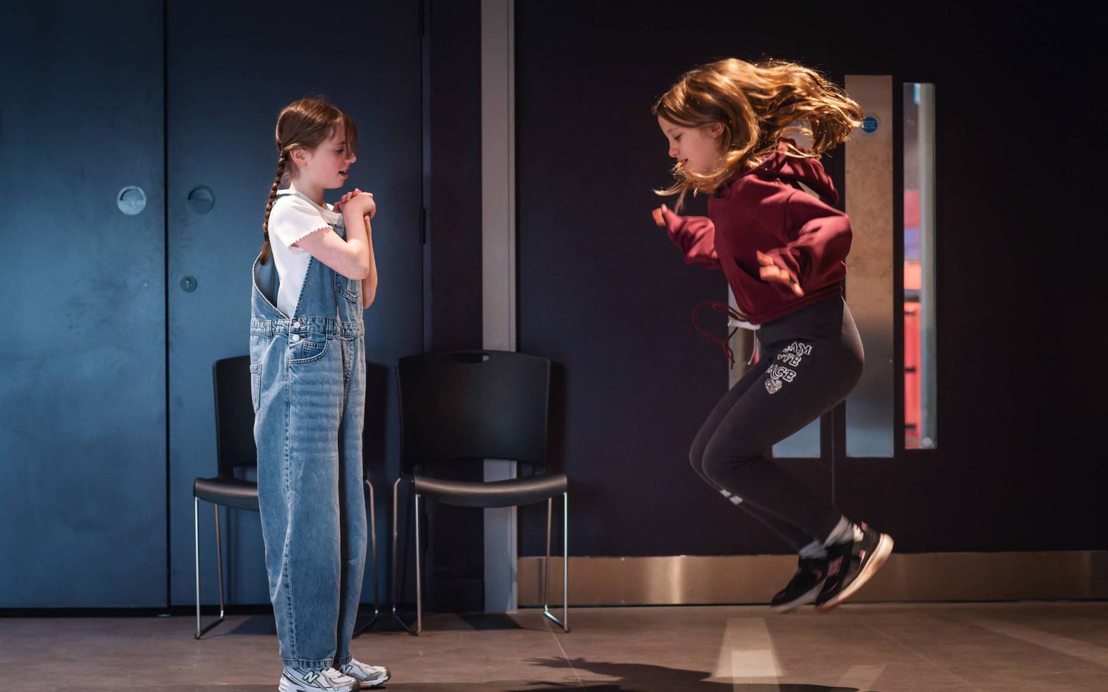 Two girls taking part in a drama class at the Citizens Theatre.