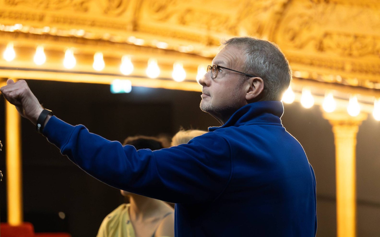 A man in our auditorium pointing