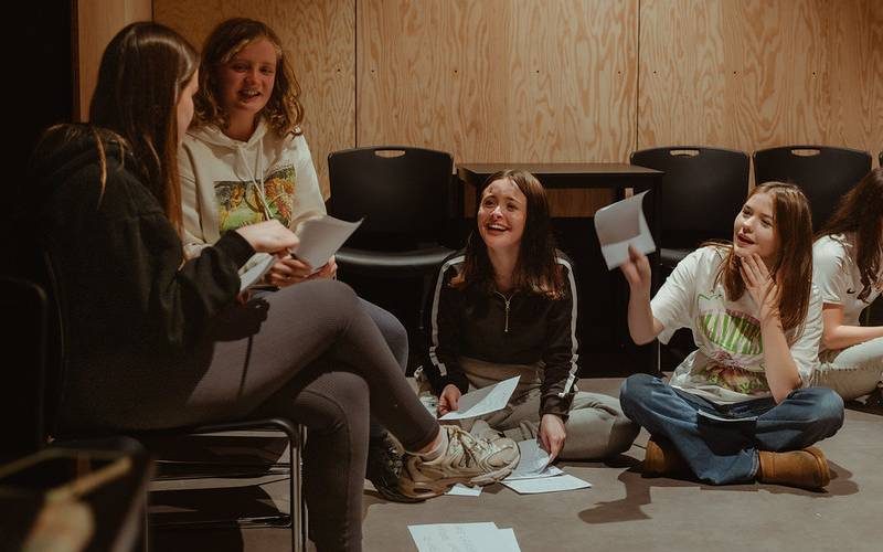 A group of secondary school students taking part in a workshop at the Citizens Theatre.