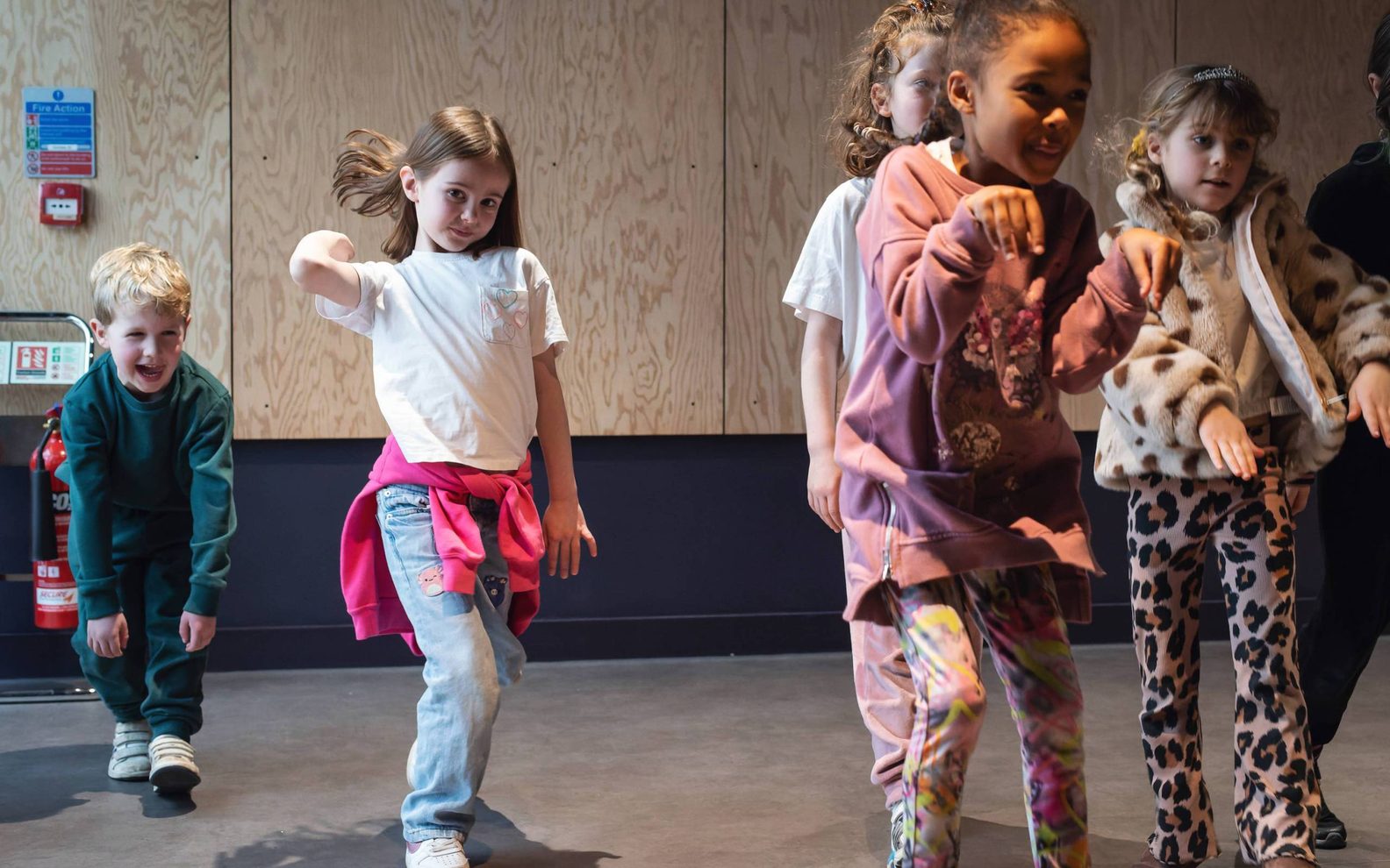 A group of primary school children taking part in a drama class at the Citizens Theatre.